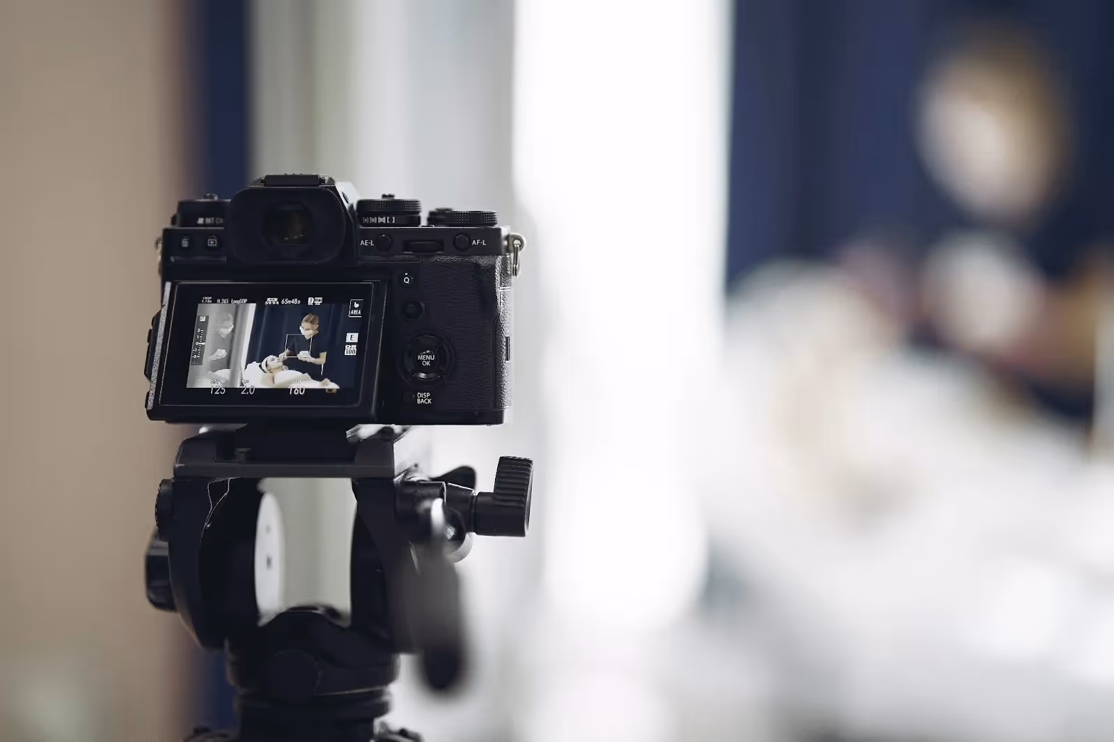camera on a tripod filming a spa procedure