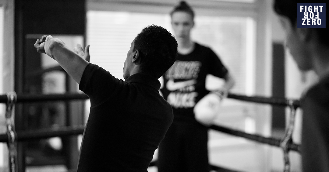 A black and white photo of a boxing training class 