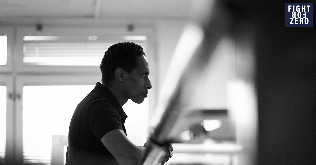 A black and white photo of a boxer looking away 