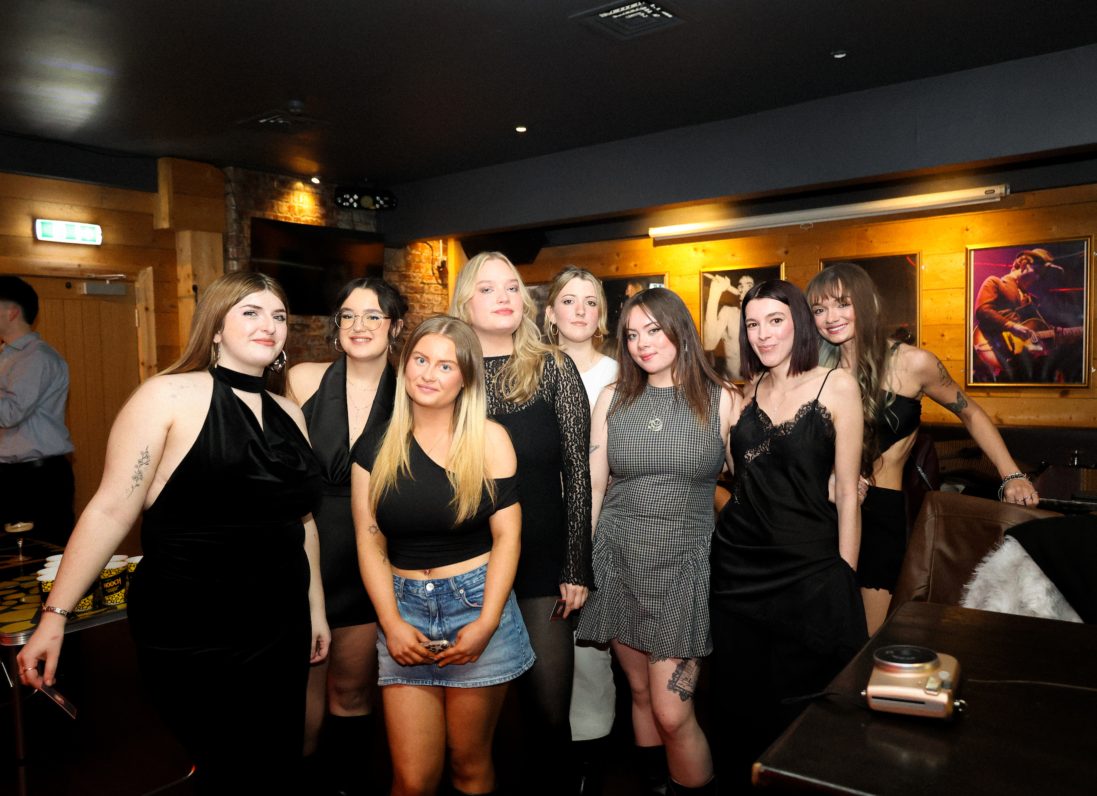 A group of girls posing for the camera.