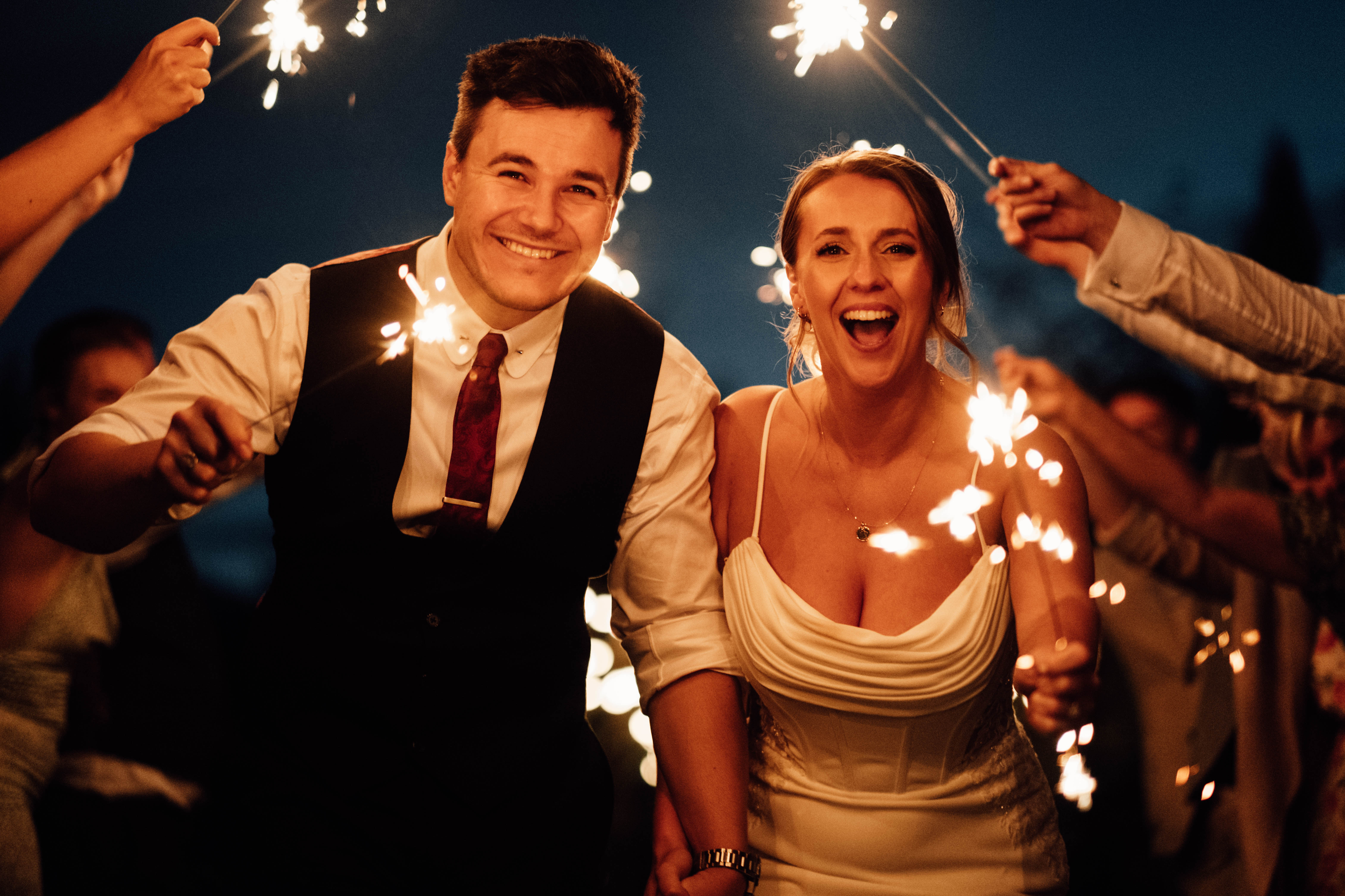 Bride and groom walk through sparklers line, Kent Wedding Photography