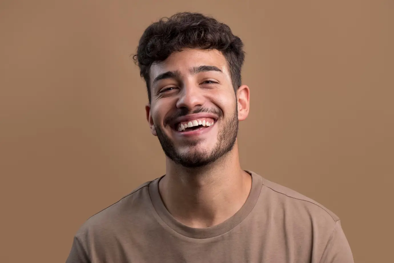 A man with beard smiling