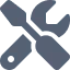 Icon of a wrench crossed with a screwdriver symbolizing tools or settings.