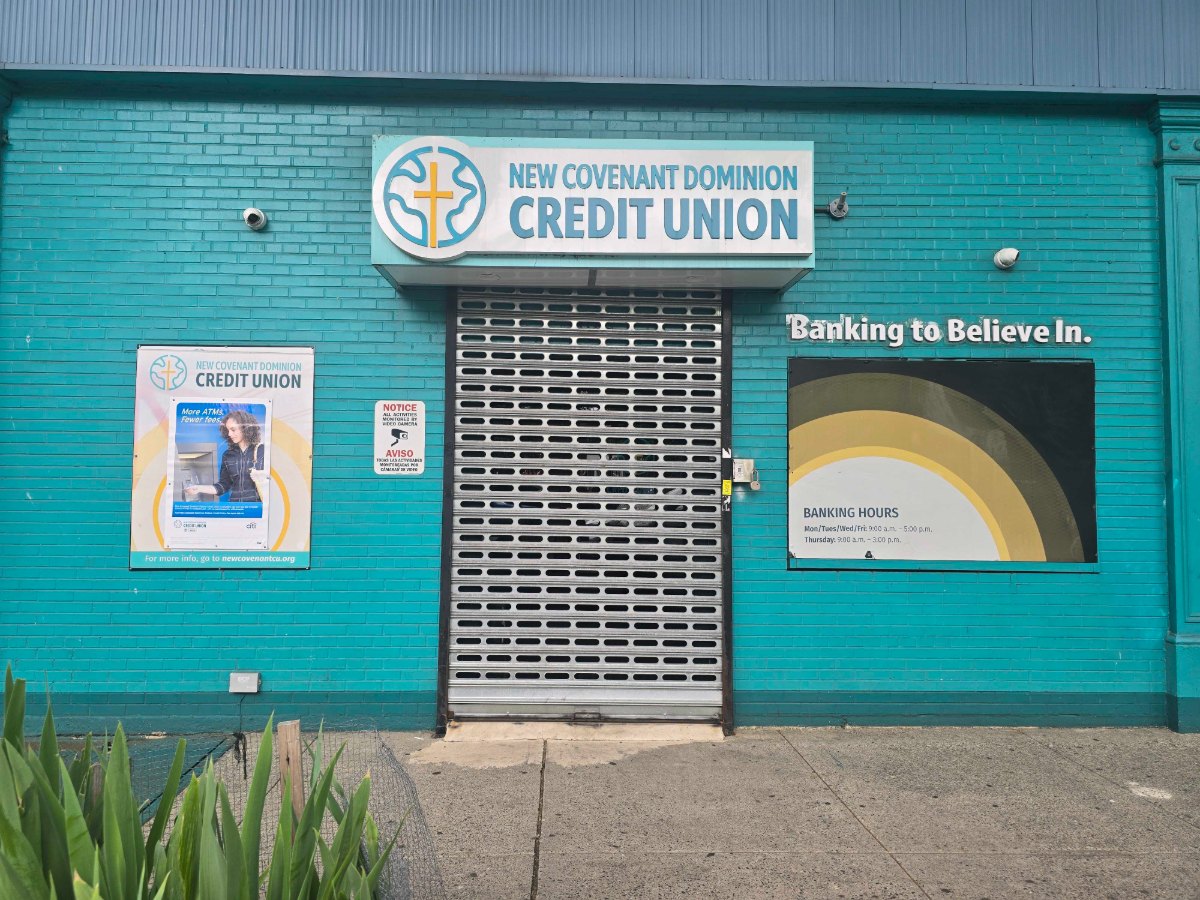 The New Covenant Dominion Federal Credit Union branch, with its Banking to Believe In sign