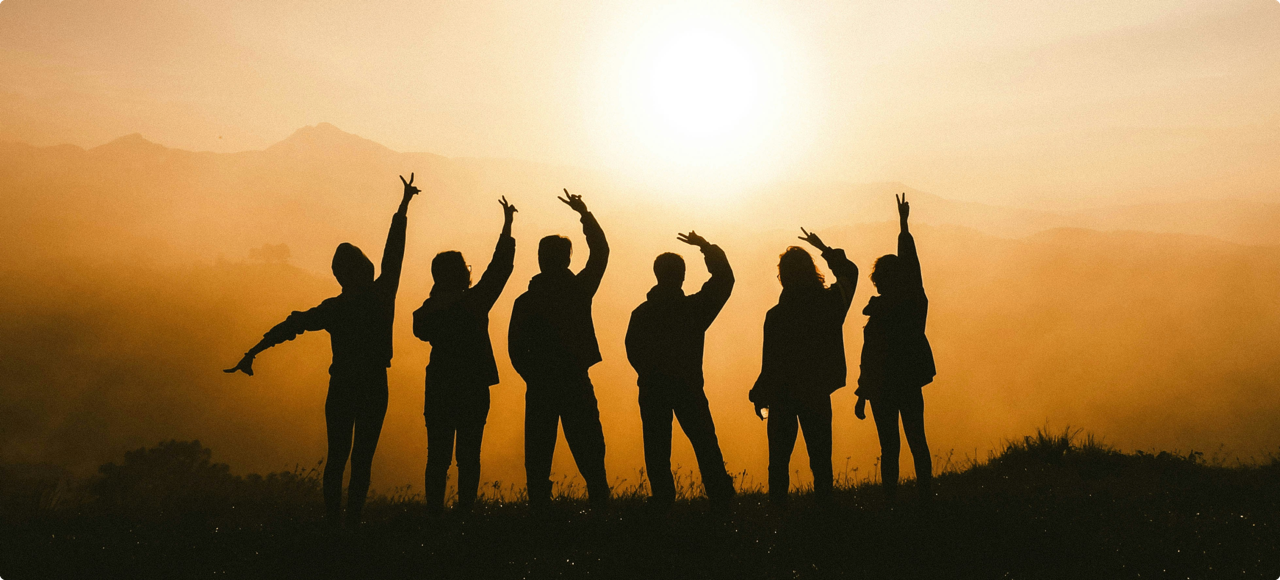 A group of people at the top of a mountain