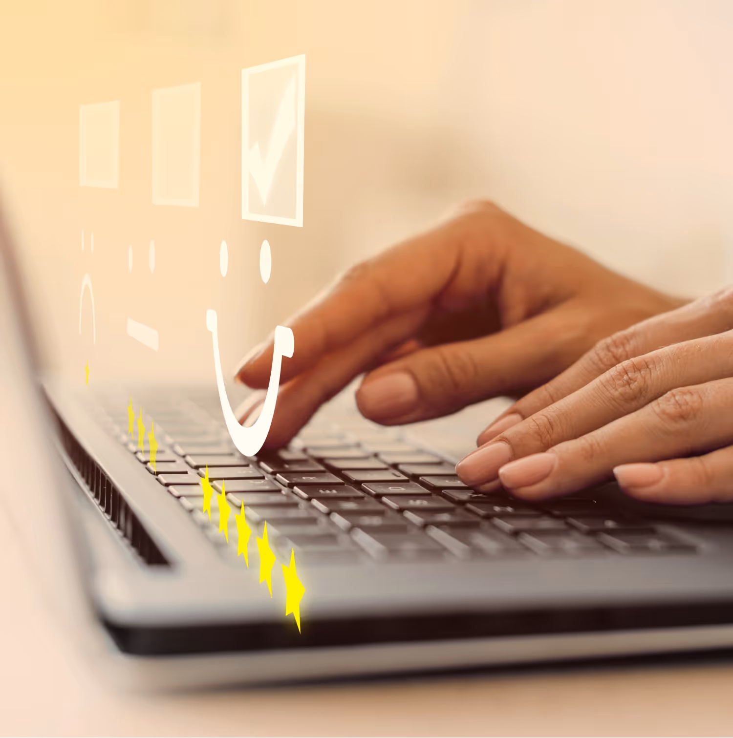 A person smiling while typing on a laptop featuring a cheerful smiley face sticker on its cover.