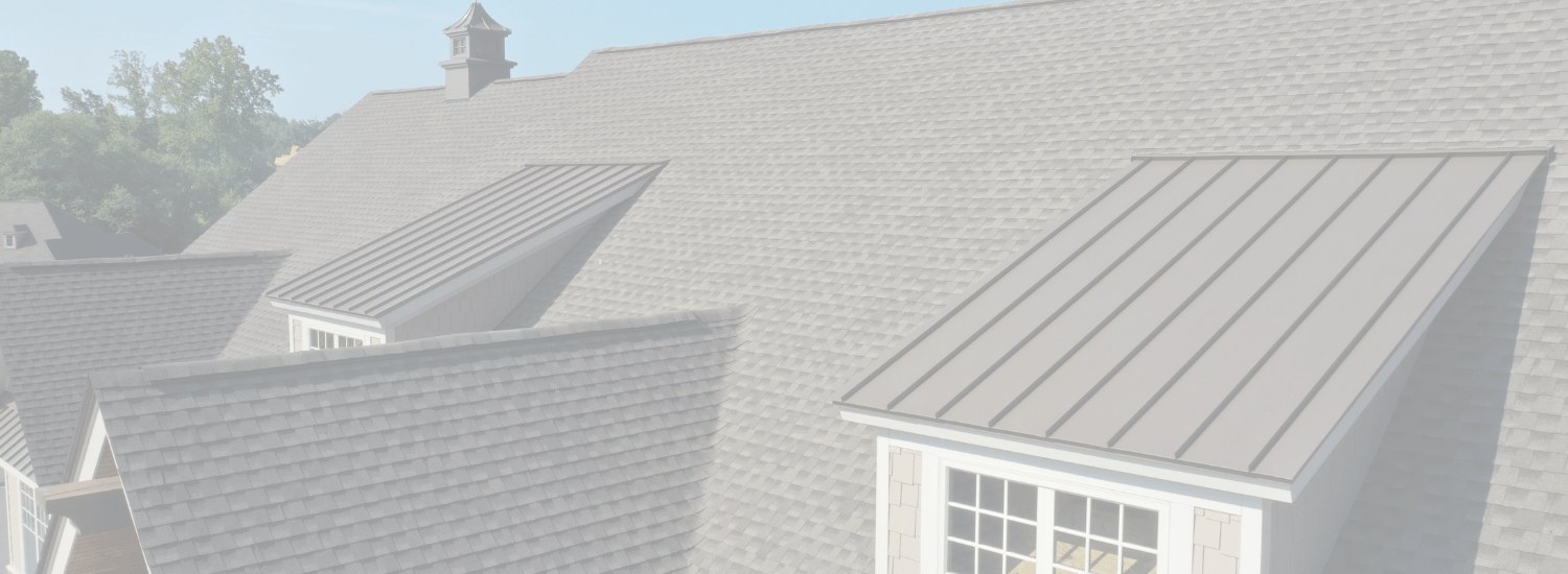 Gray house rooftops with shingle and metal roofing panels, the two most common roof replacement choices in Seattle.