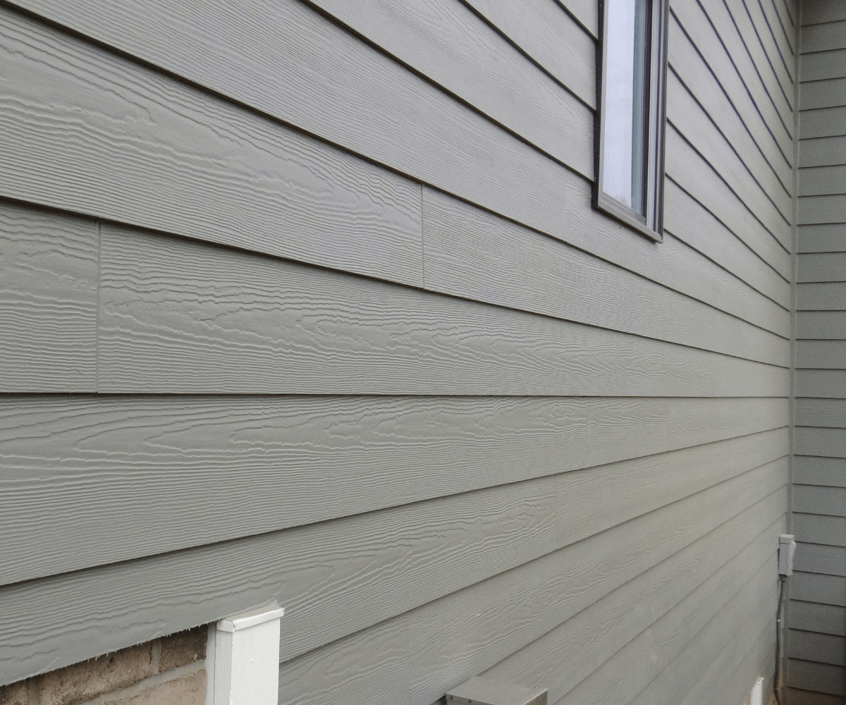 Close-up of gray horizontal lap siding on a Seattle-area home, the most common siding style replaced in Western Washington.