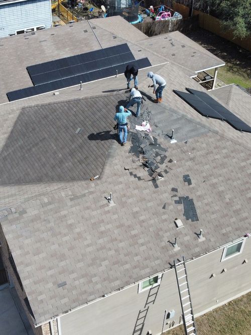 Local roofing crew completing a residential roof repair in San Antonio using Owens Corning materials.