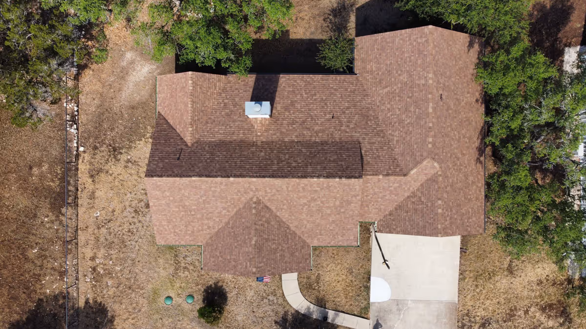 San Antonio Roofing company making roof repairs on asphalt shingles.