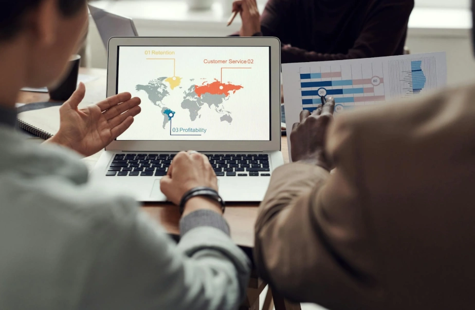 people analyzing data of map and stats