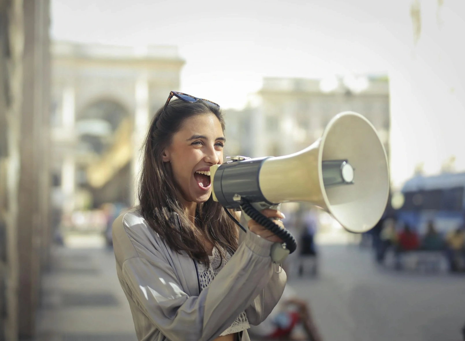 women speaking into microphone