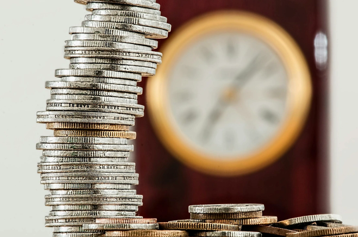 Coins set in the backdrop of a clock