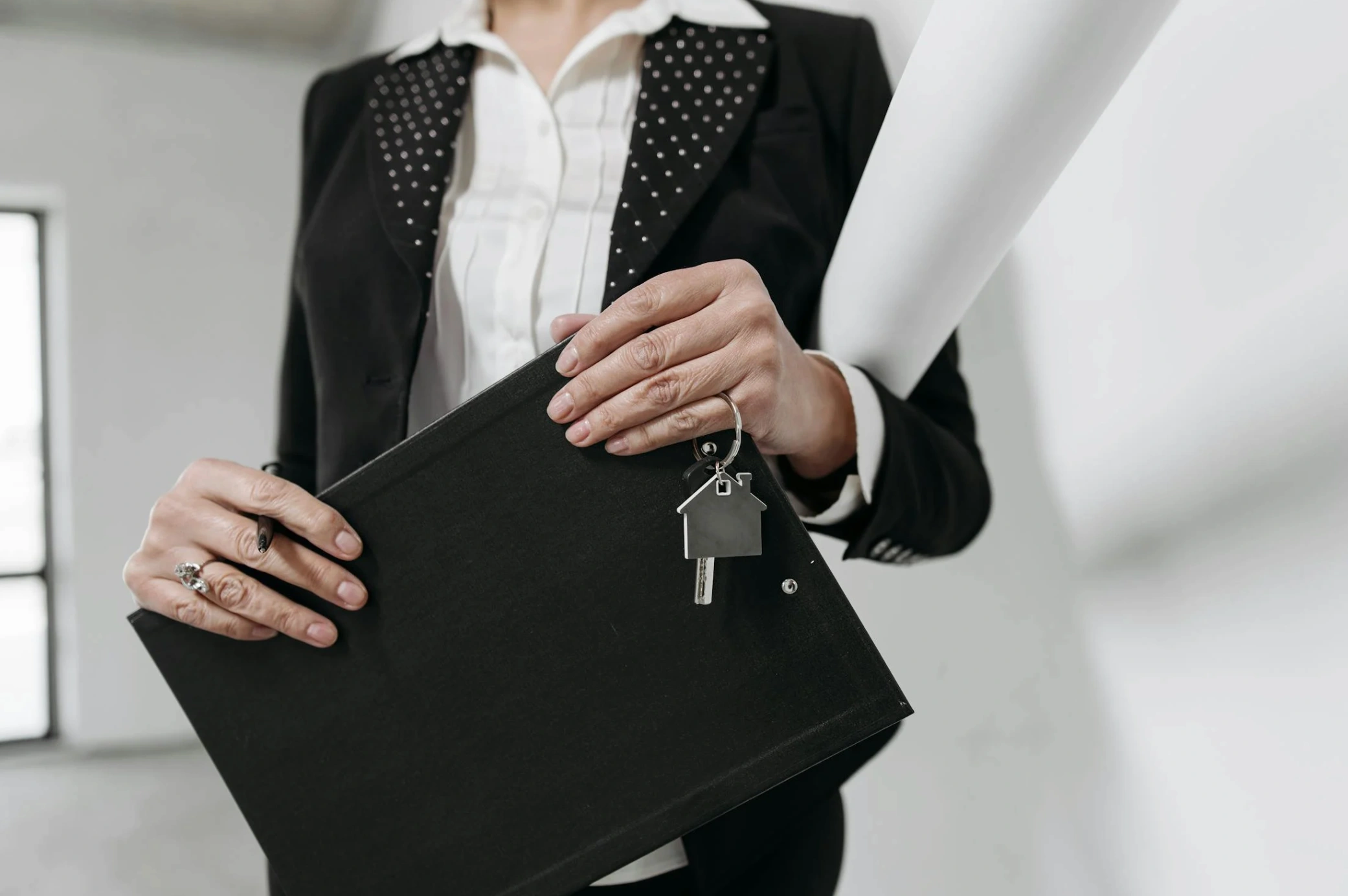 real estate agent holding house key