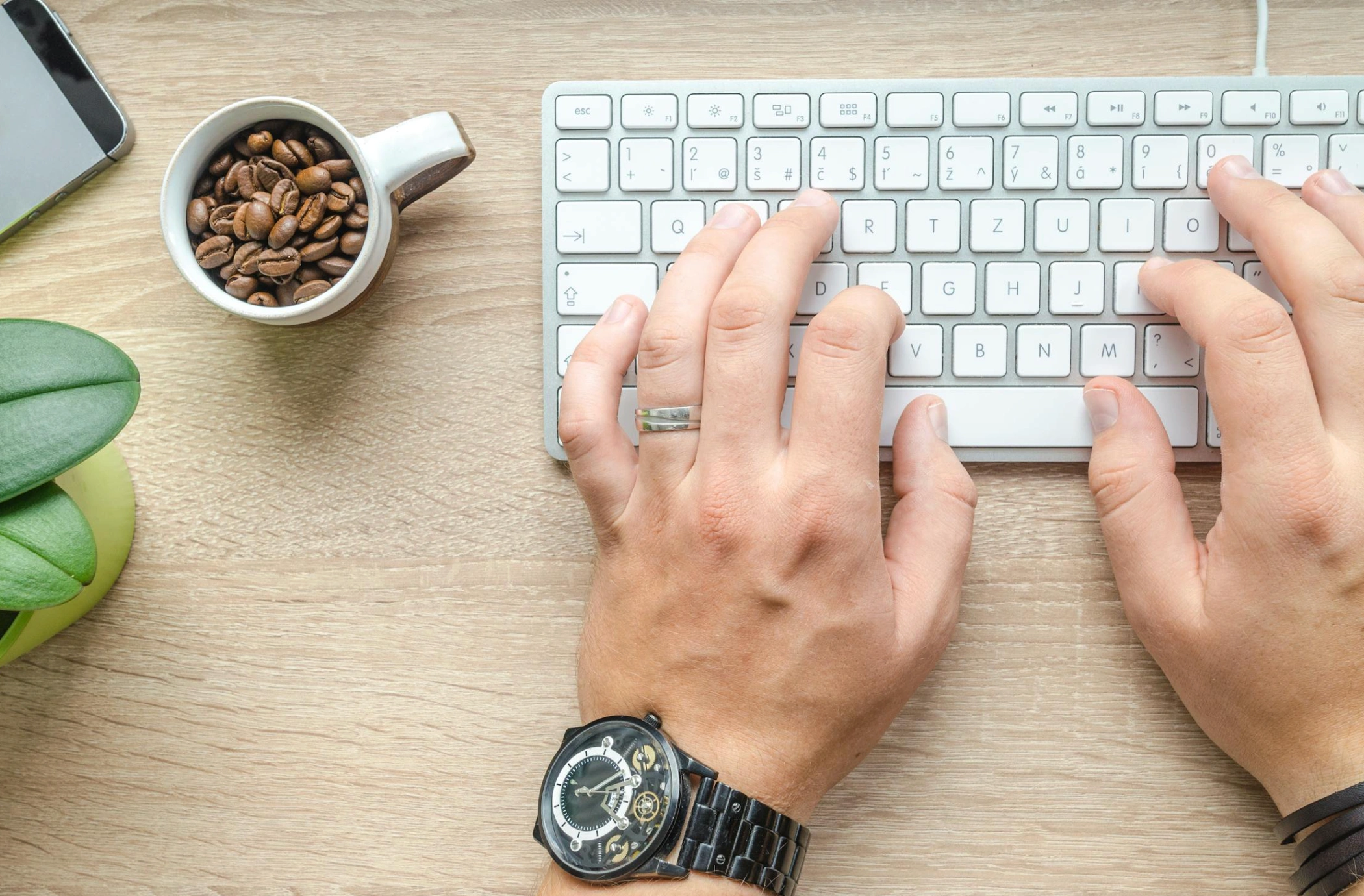 person typing on keyboard