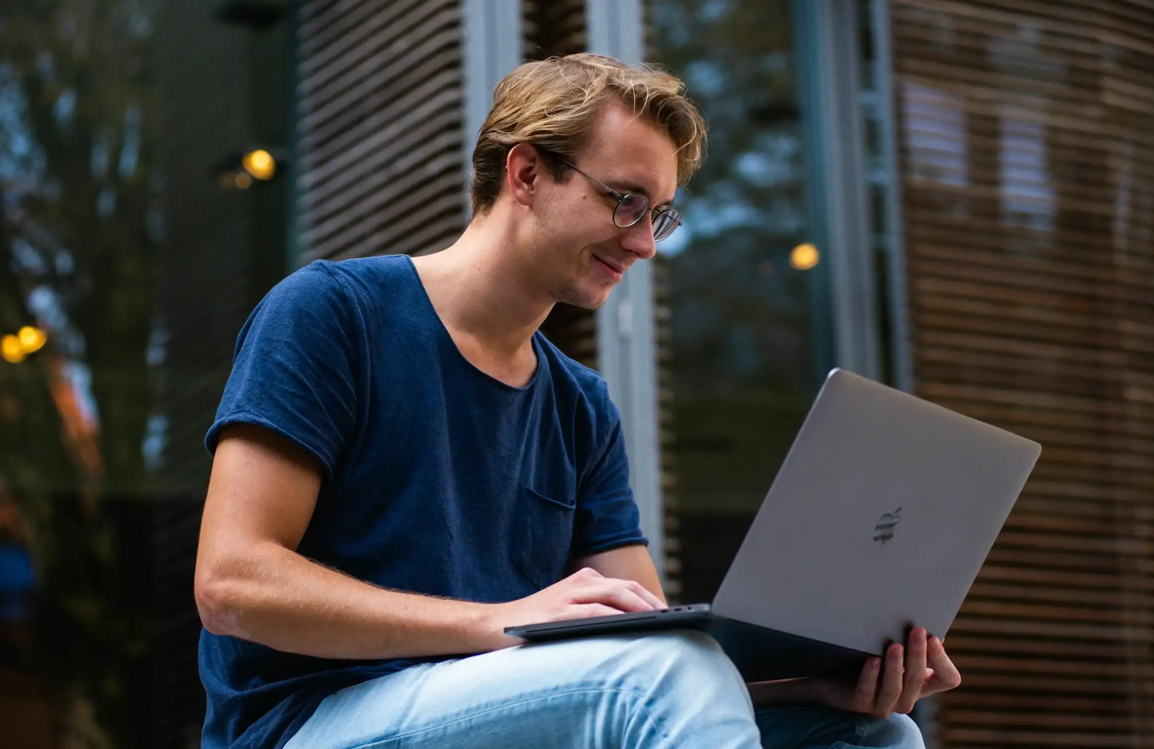 content man gazing at laptop