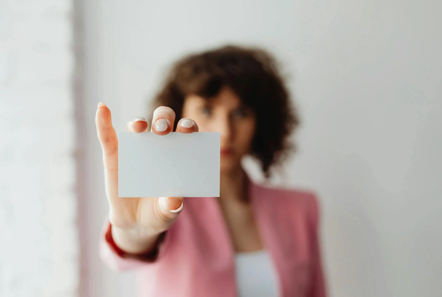 woman holding business card