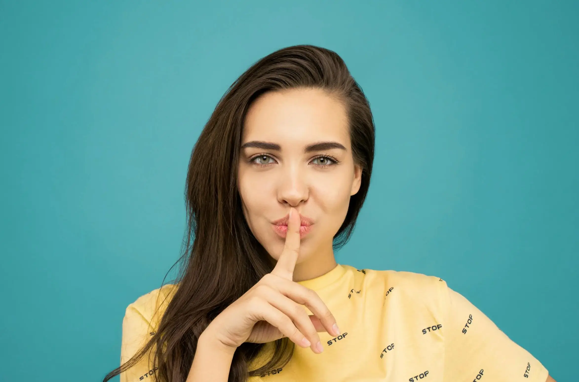 woman doing a "shhh" movement