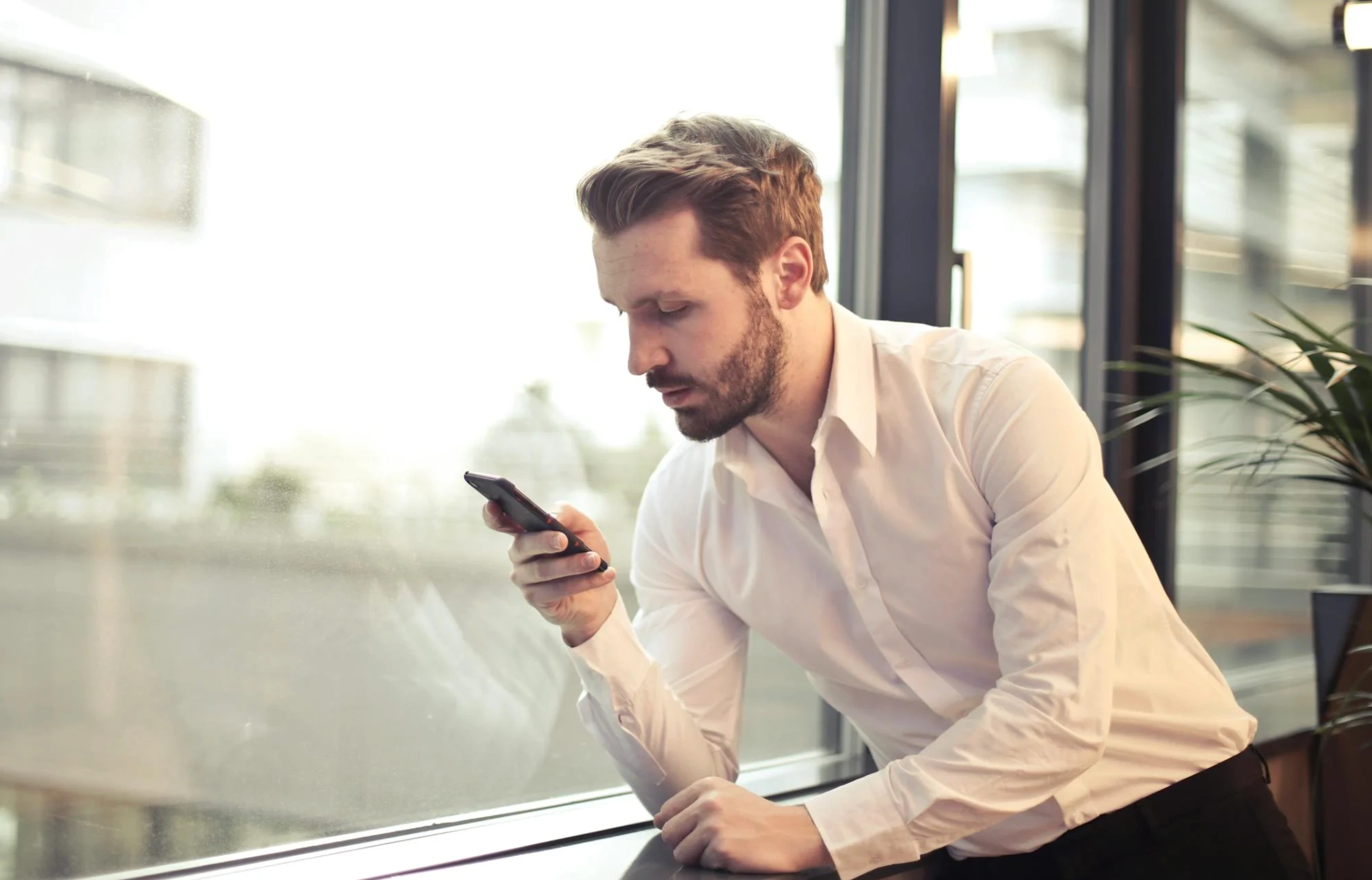 man checking mobile device