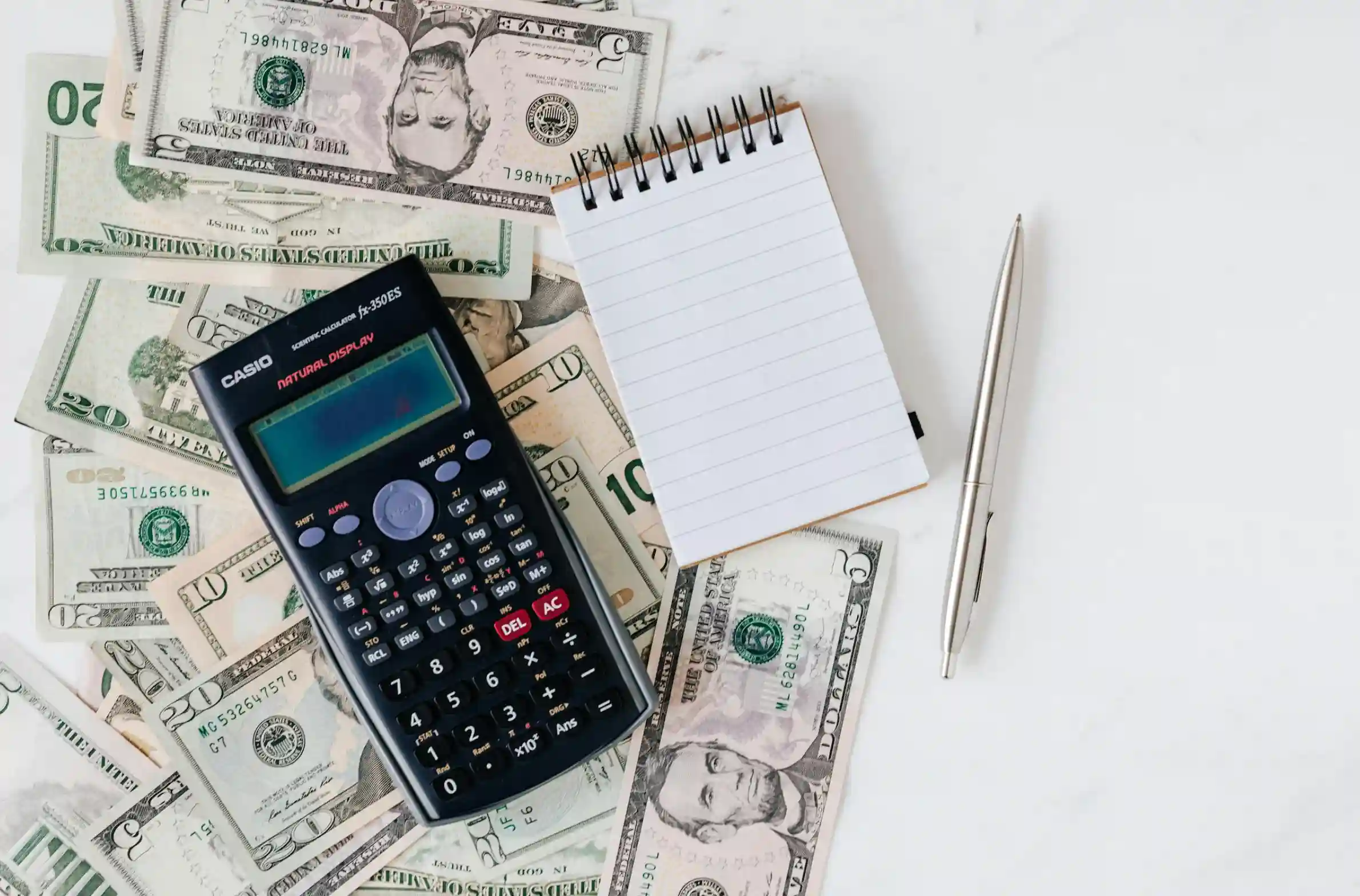 budgeting cash with calculator and note pad
