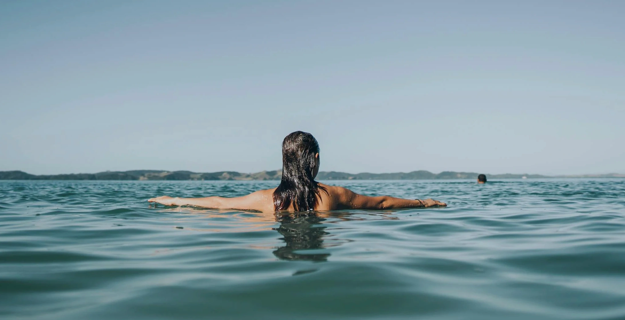 woman swimming in water