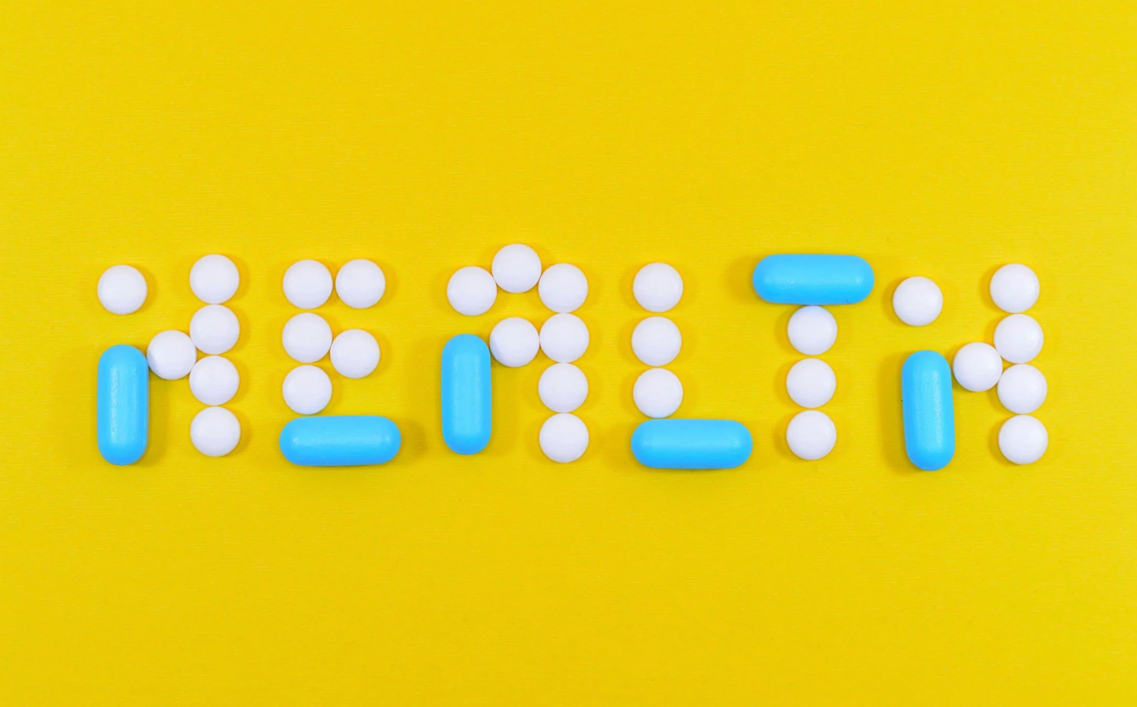 word health drawn out in pills