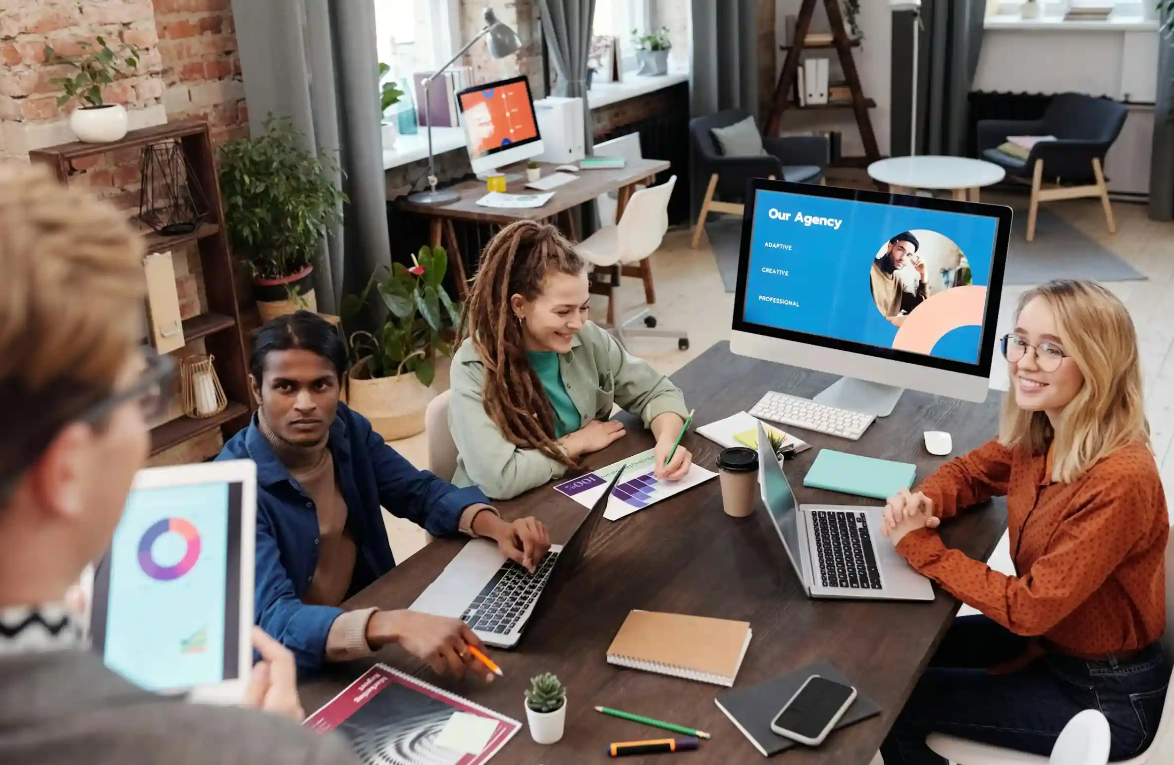 a group of people working for an agency