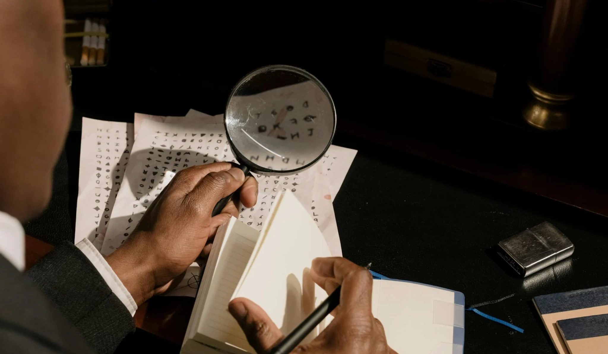 man analyzing letters with magnifying glass