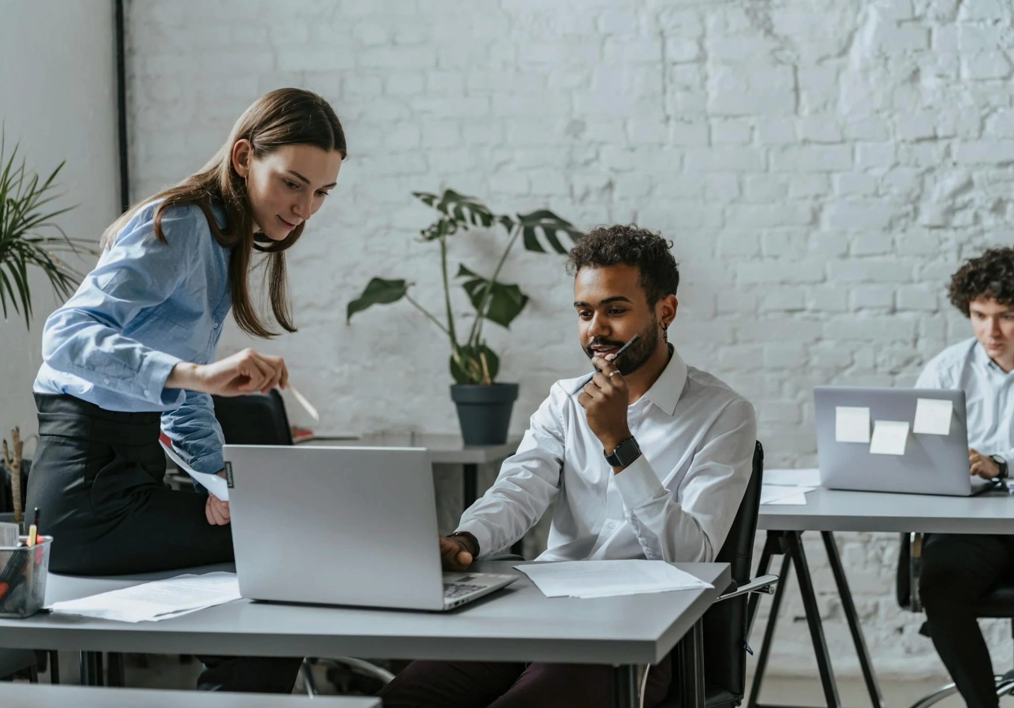 man and woman working on project