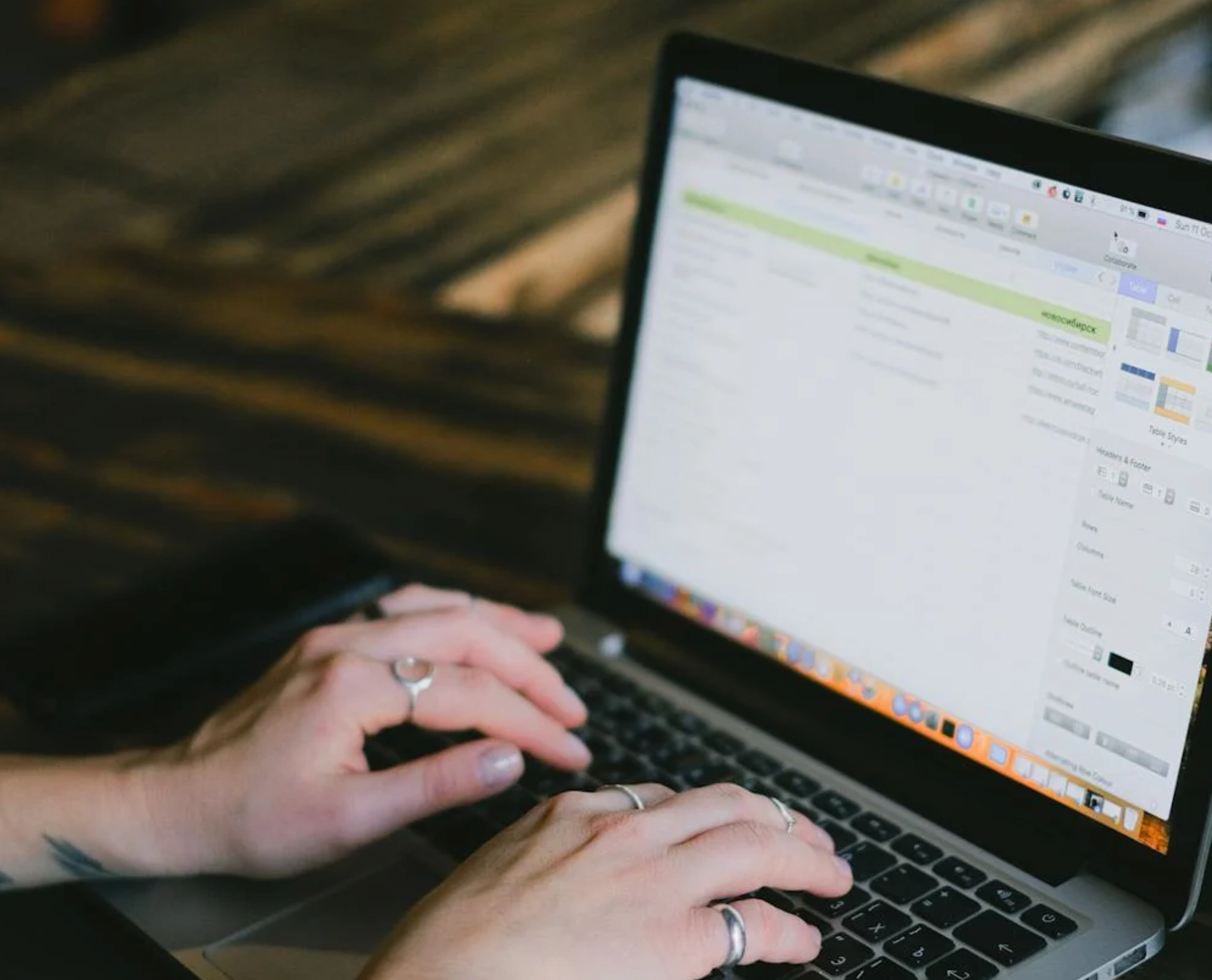 person typing on laptop