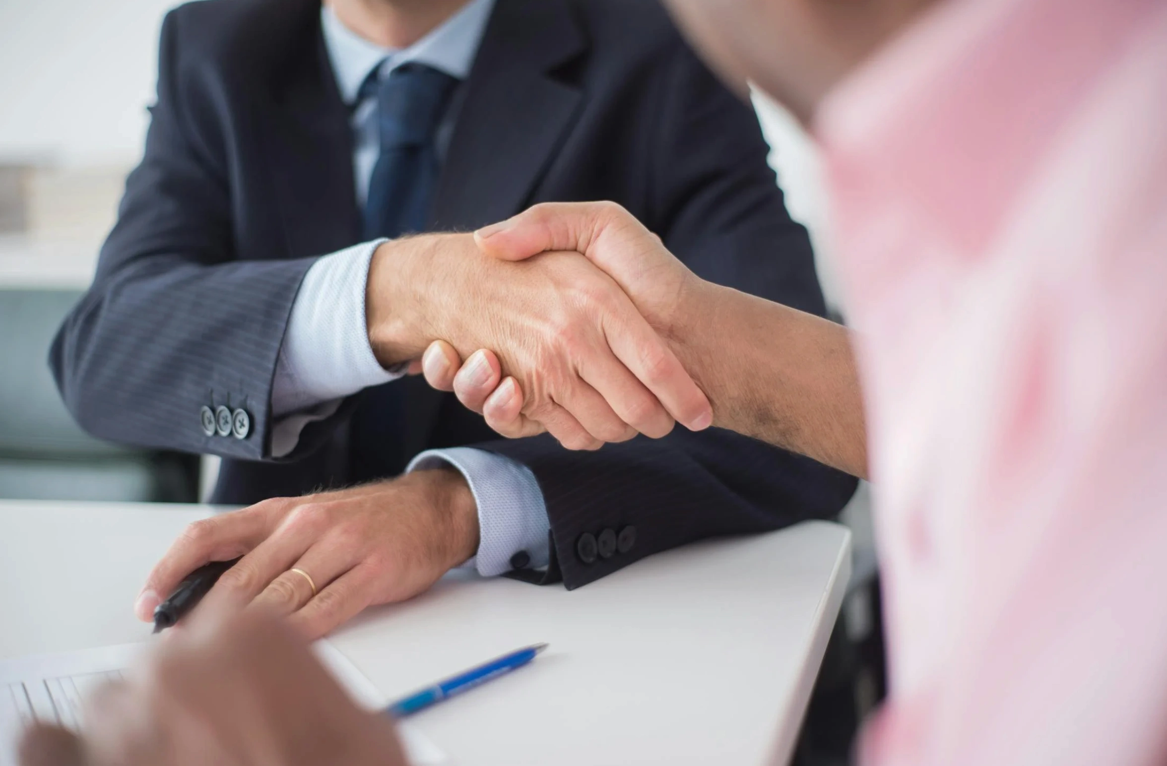 people shaking on a deal