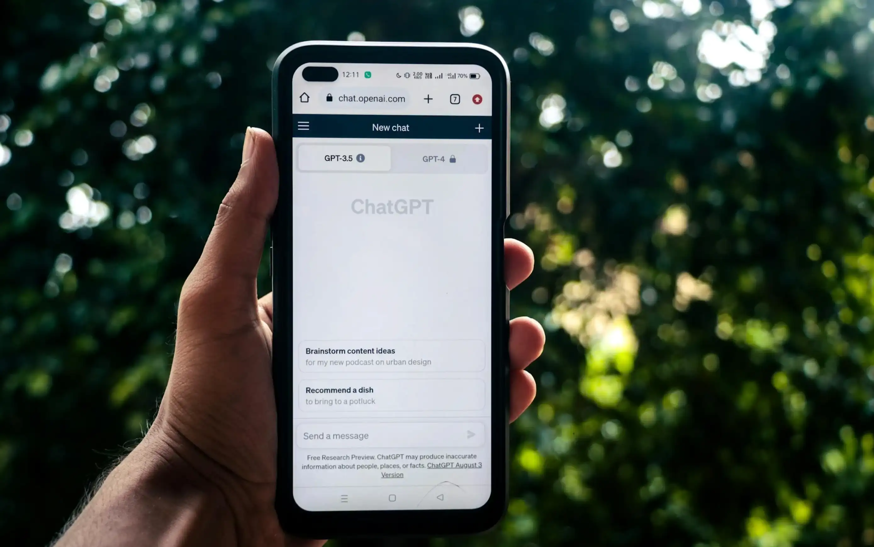 person holding device displaying AI