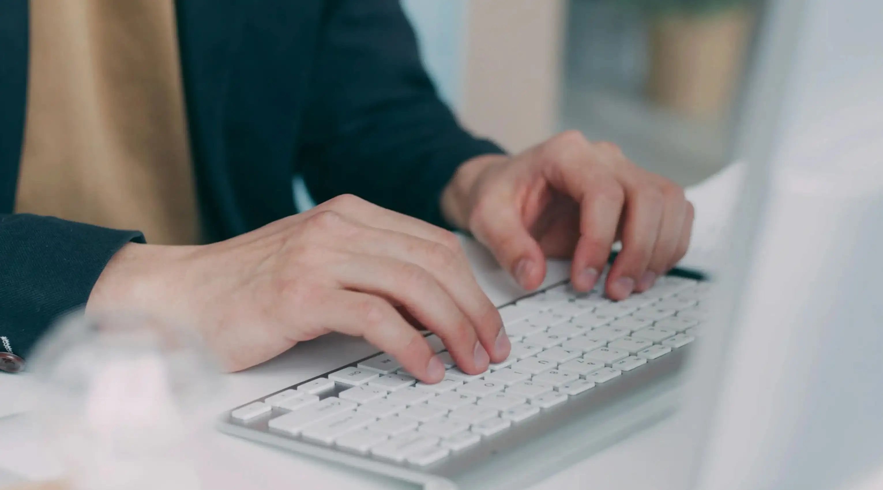 person typing on laptop