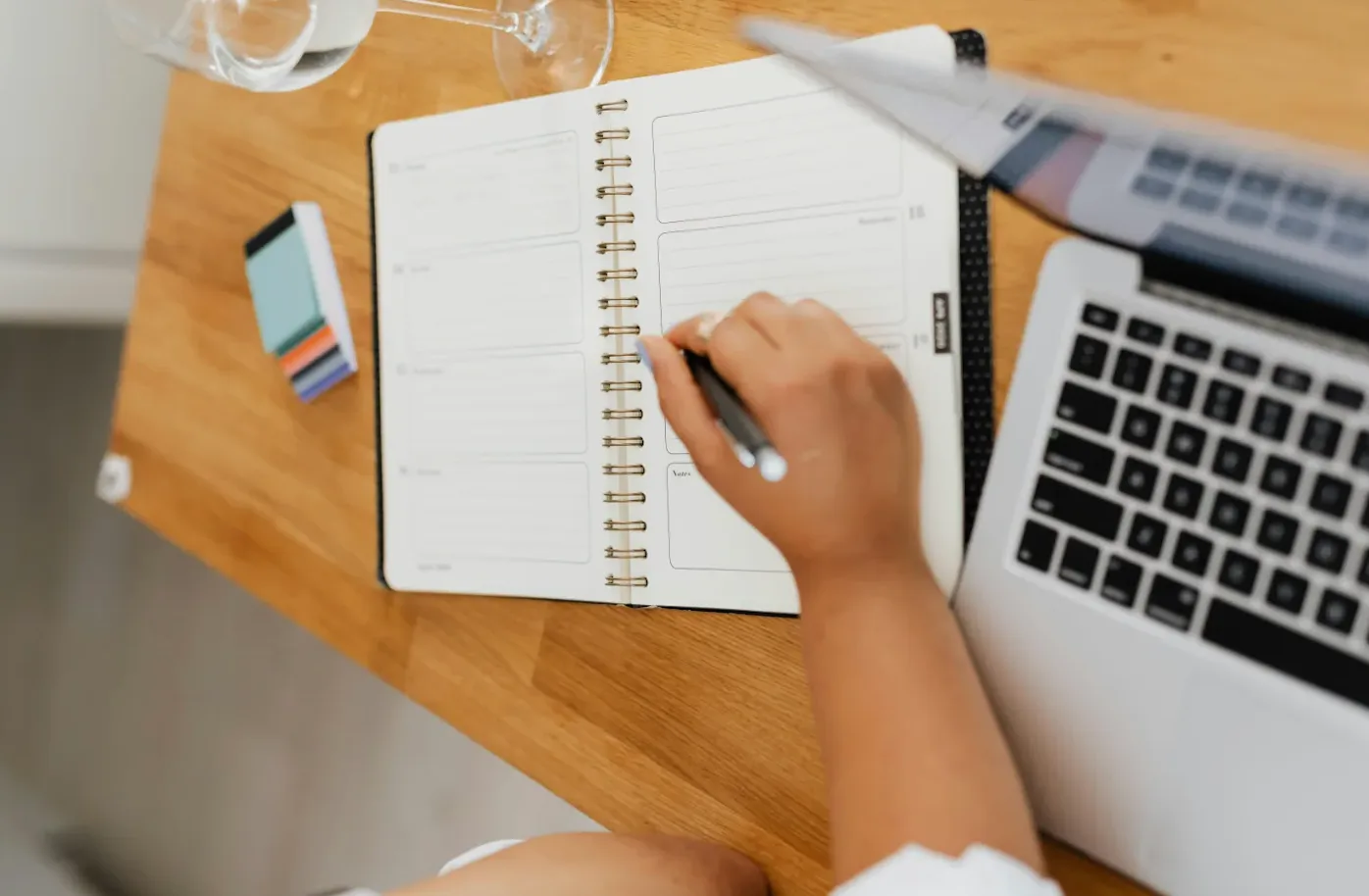 woman writing in planner