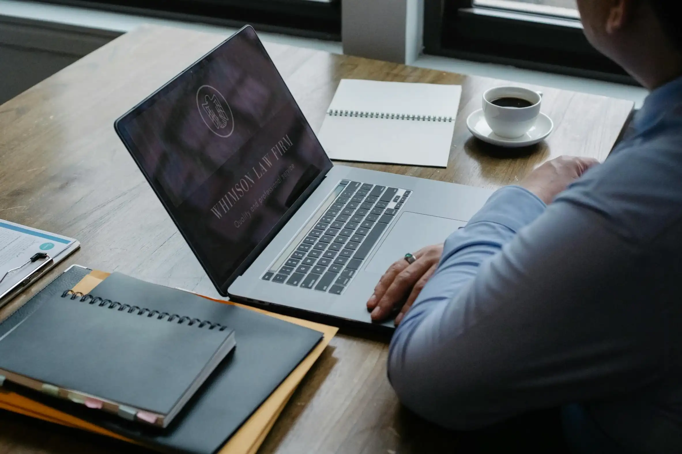 law firm company page on laptop