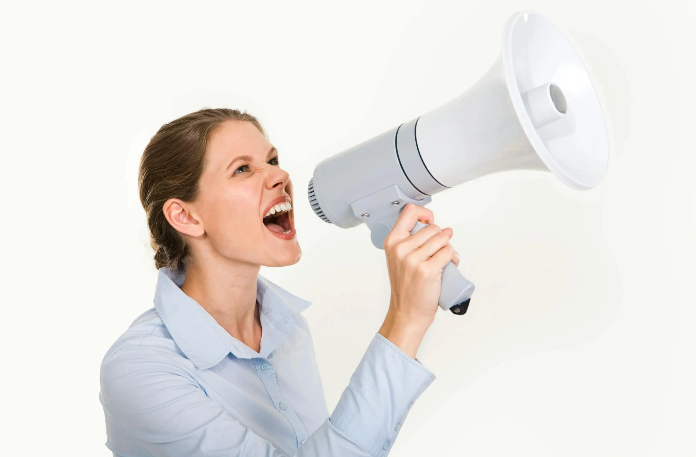 woman speaking into speaker