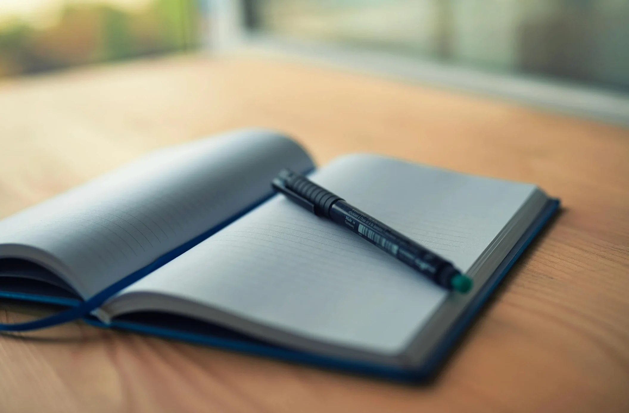 open notebook with pen