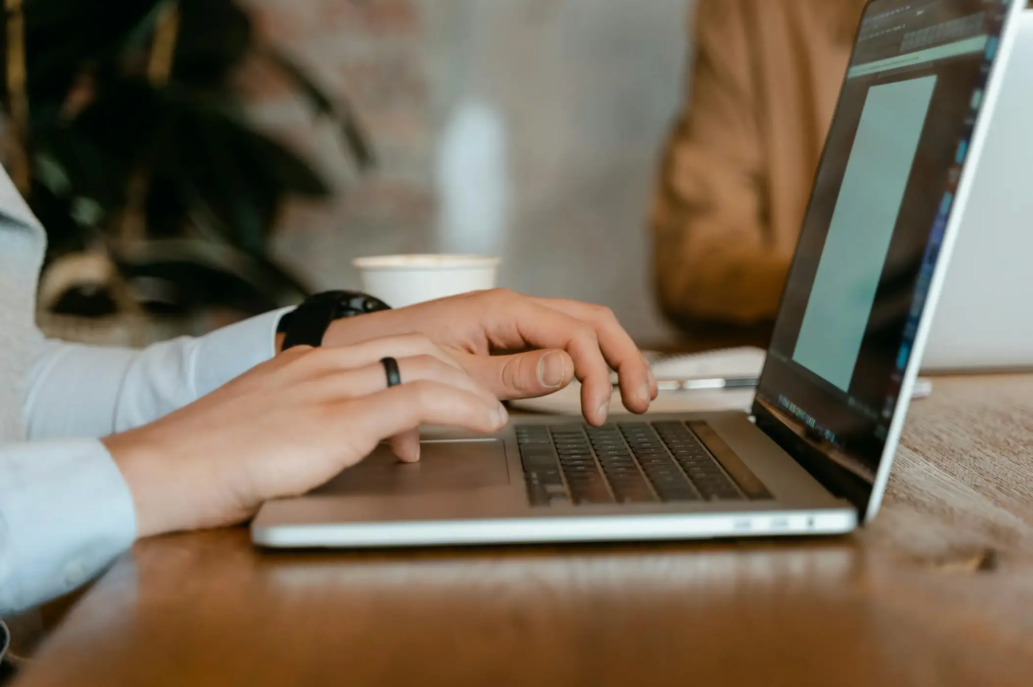 woman typing on laptop