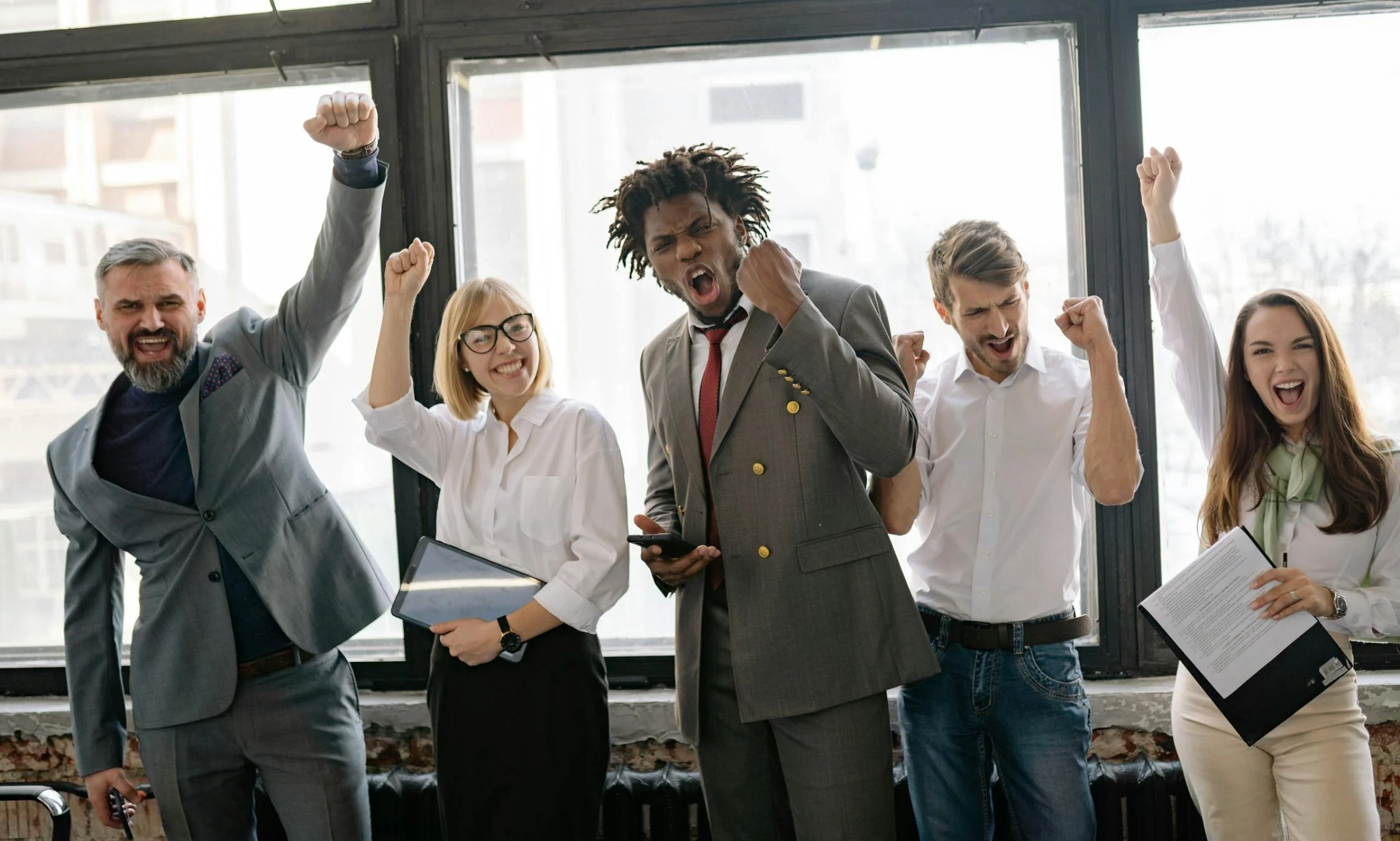 team with fists in air