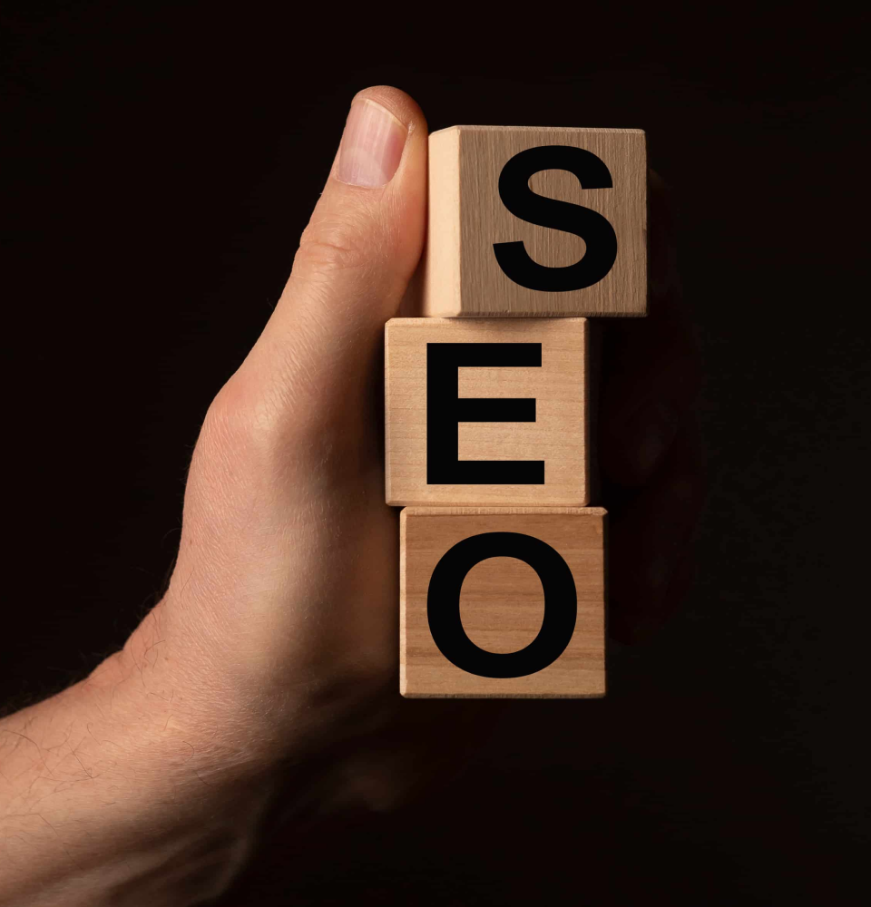 Person holding a digital dashboard showing SEO services Canada analytics, rankings, and optimization metrics.