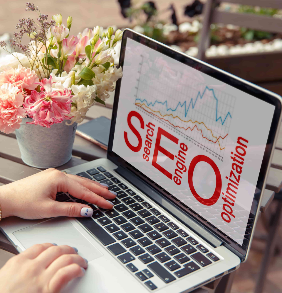 Person holding a tablet showing SEO services Canada process with content, web analysis, traffic, and ranking icons.