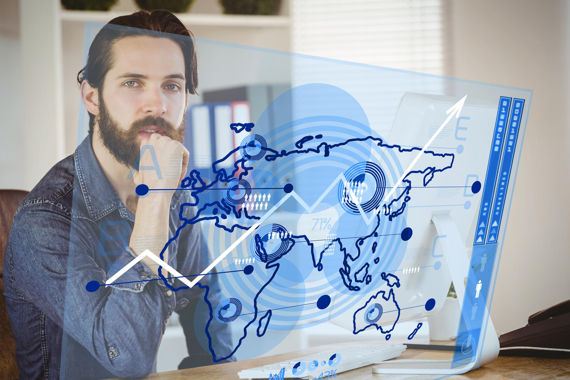 Man reviewing global analytics on a transparent display showing how to scale local SEO across regions.