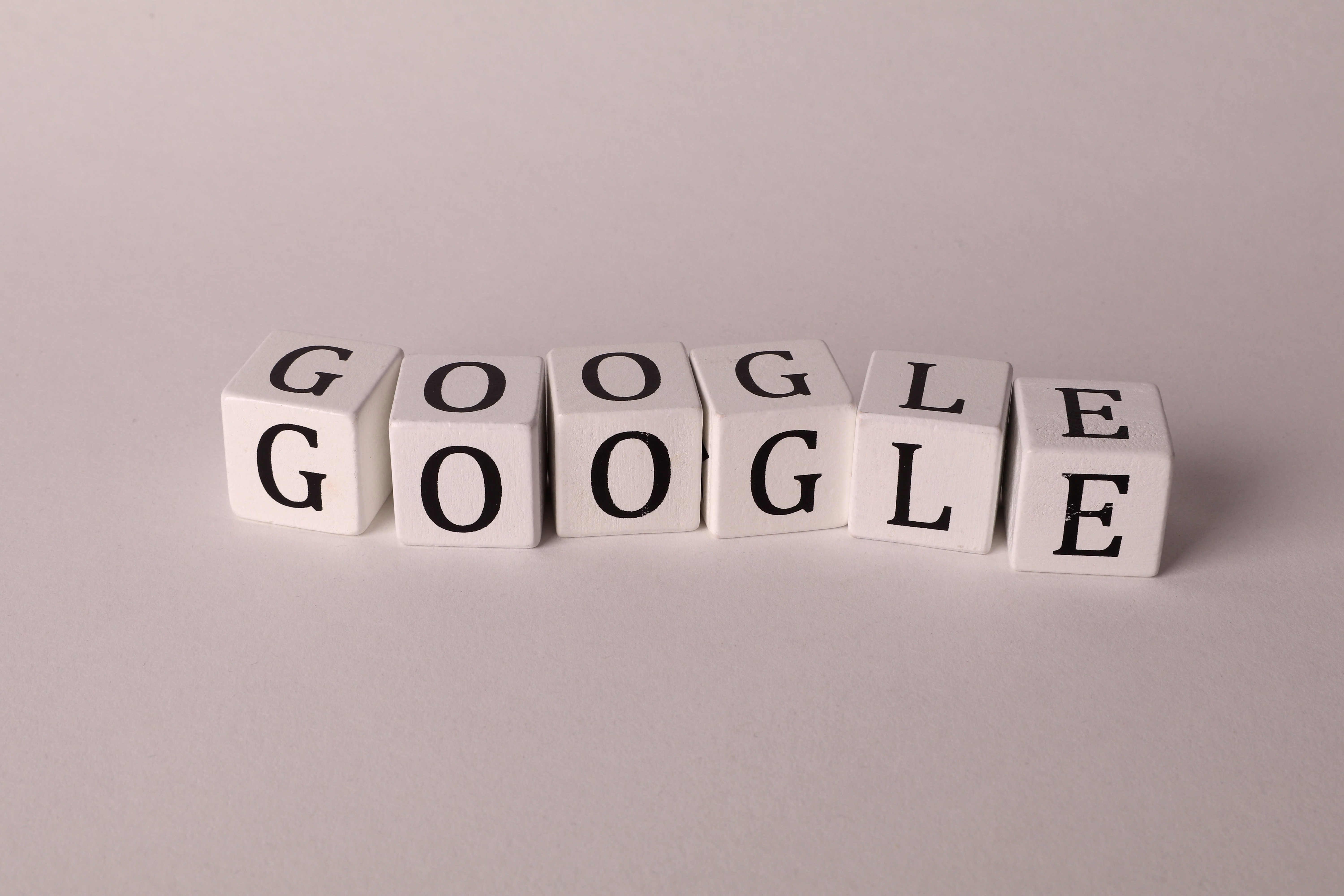 Google letter blocks stacked twice on plain light gray background