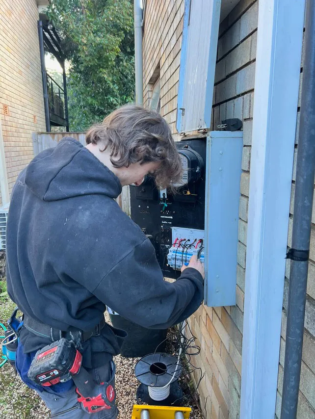 Man fixing electrical wires