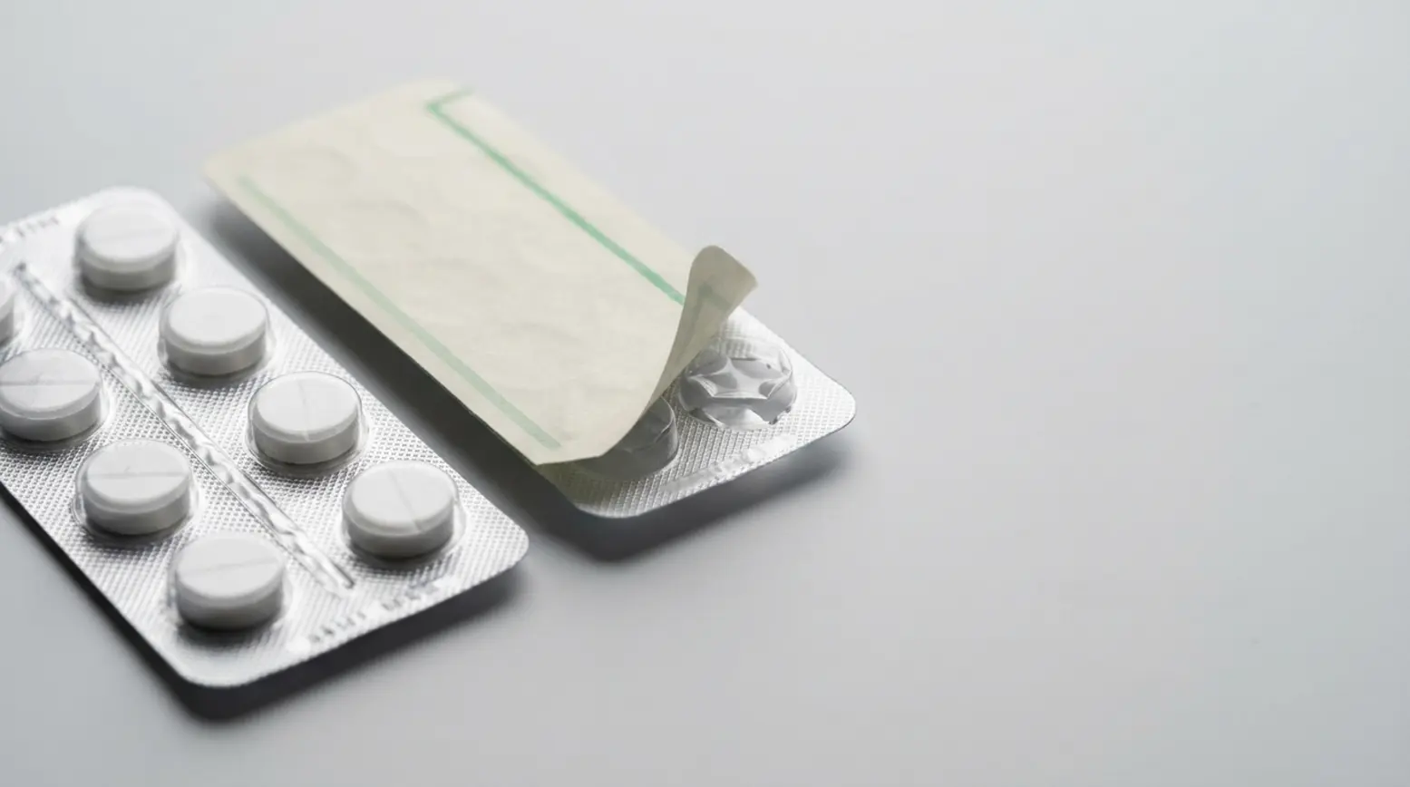 Two pharmaceutical blister packs showcasing tablet protection and packaging contrasts.