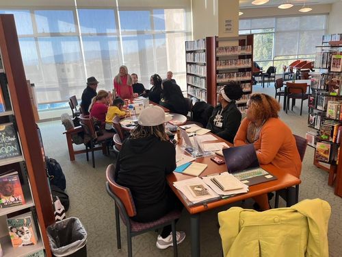 Poetry workshop attendees get ready to write.