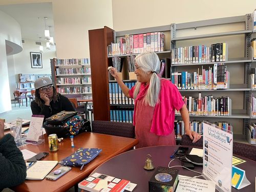 Maw Shein Win inspiring attendees to write.