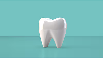Diente blanco en primer plano sobre fondo verde menta, ilustrando membresía dental y servicios odontológicos.