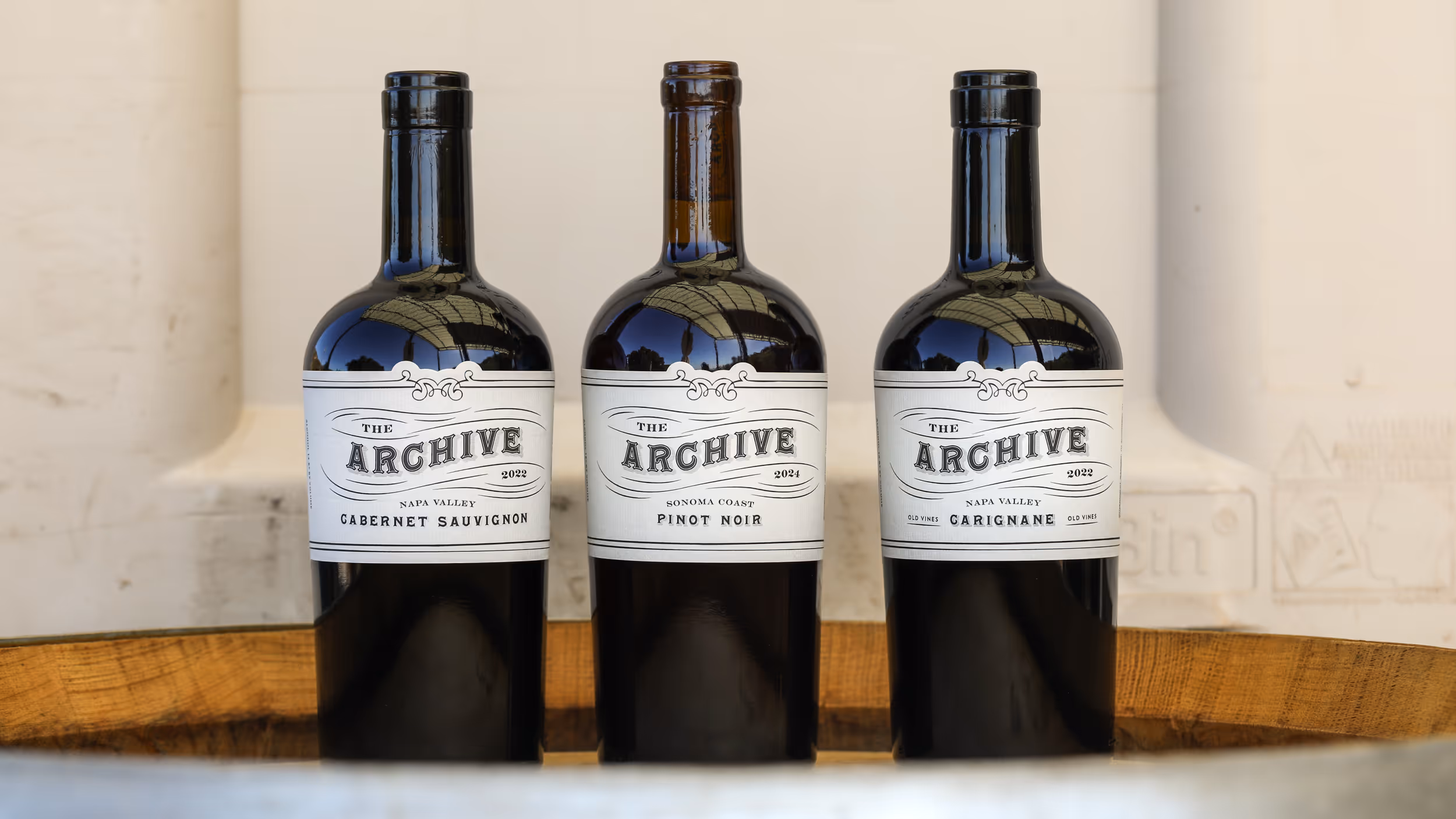 Mike and Schatzi in front of a Husic vineyard row at golden hour.