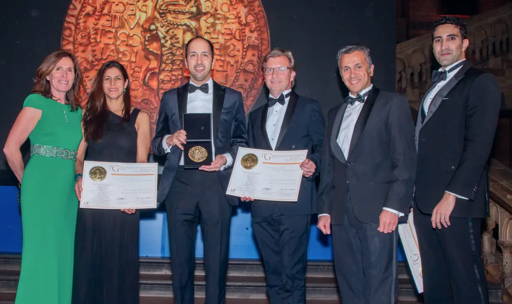 Group of people with an award.